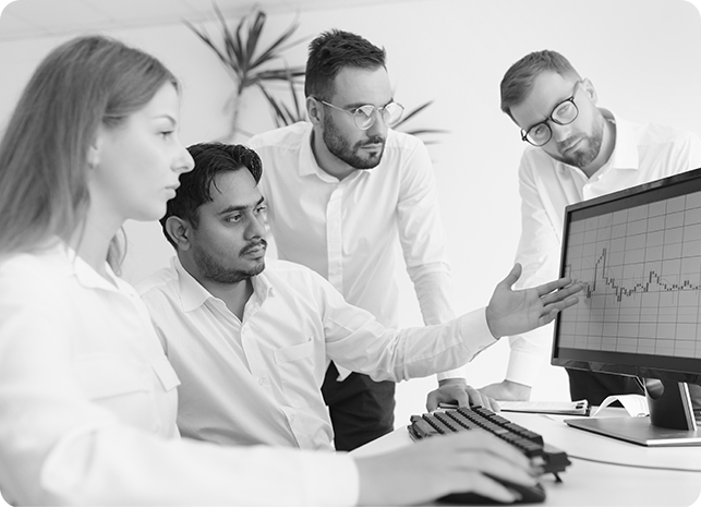Collaborative Financial Planning and Analytics Team Team of professionals discussing data at desk