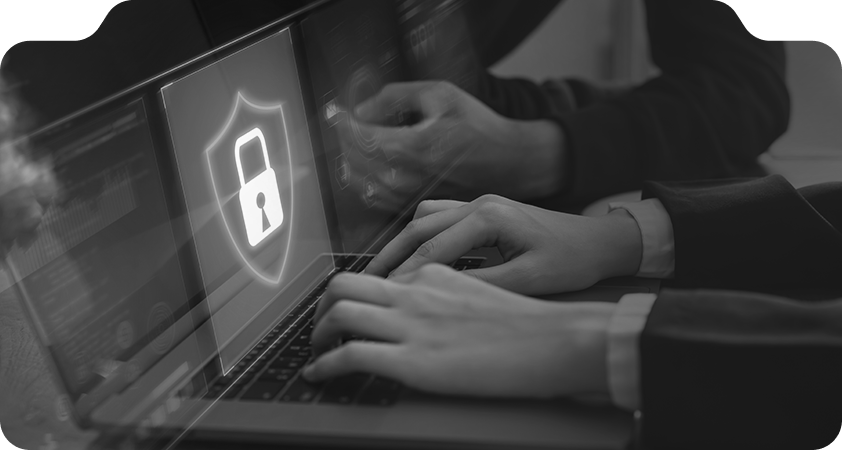 Data Protection and Cybersecurity Measures for Online Safety Hands typing on laptop with digital padlock icon representing cybersecurity protection